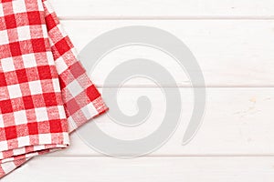 Red cloth napkin on wooden background