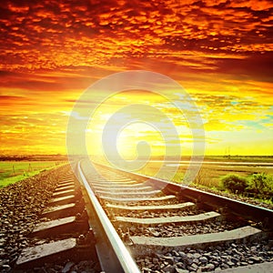 Red clouds and railroad to horizon