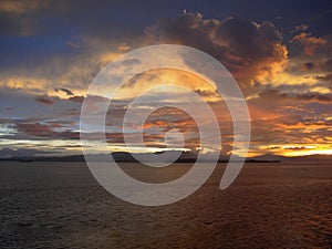 Red Clouds Reflect Sunrise in the Sea inside Panama Canal