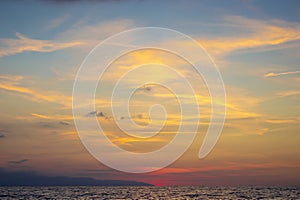 Red Clouds Sunset Above Water. Seascape in early morning, sunrise over sea. Nature landscape