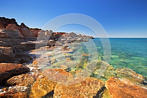 Red coastal cliffs at Gantheaume Point, Broome, Australia photo