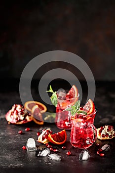 Red cocktail with blood orange and pomegranate