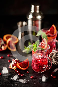 Red cocktail with blood orange and pomegranate