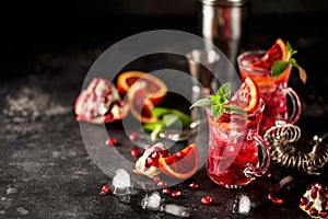 Red cocktail with blood orange and pomegranate