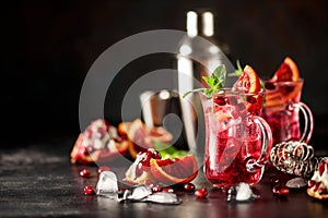 Red cocktail with blood orange and pomegranate