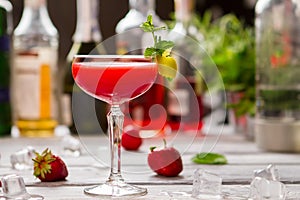 Red cocktail in a glass.