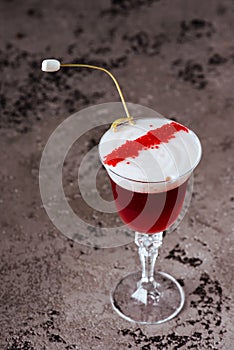 Red cocktail isolated on a black background. close-up. beautiful cocktail.