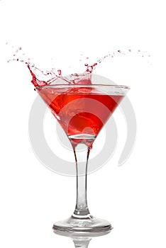 Red cocktail with splash isolated