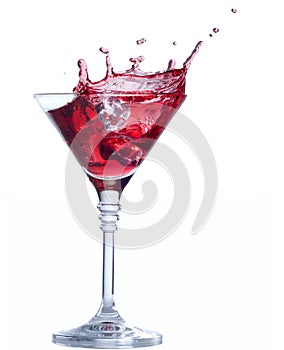 Red cocktail with splash isolated on white