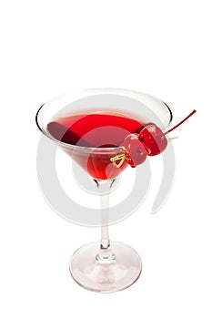 Red cocktail with two cherries. Isolated on white