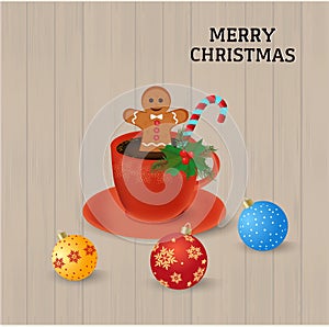 Red coffee cup with gingerbread man cookee and candy cane decorated green leafs, boughs spruce and snowfalls near Christmas balls