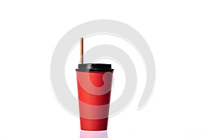 Red coffee cup with paper straw isolated on white background. Eco-friendly