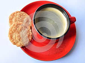 Red coffee cup with two biscuits
