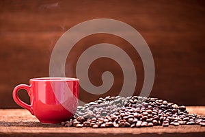 Red coffee cup on wooden table