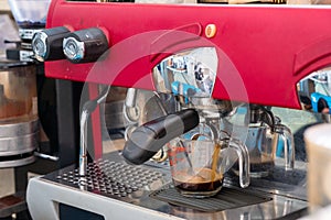 Red Coffee maker making espresso