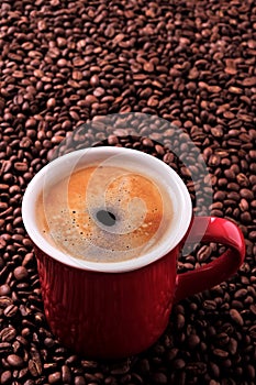 Red coffee mug americano beans background vertical copyspace