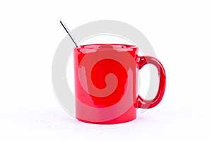 Red coffee or tea or milk mug cup and spoon on white background drink isolated