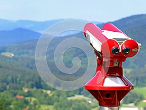 Red coin binoculars for tourists at viewpoint