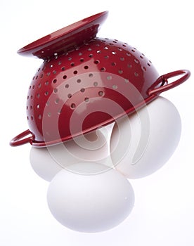 Red Colander with Fresh Eggs