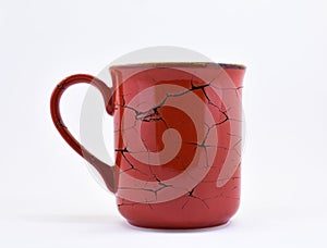 Red color, ceramic mug, with crack pattern, 