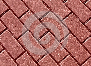 Red color cobblestone pavement close-up