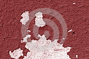 Red color cracked painted wall pattern.