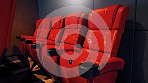 Red color leather movie theater cinema seat chairs.