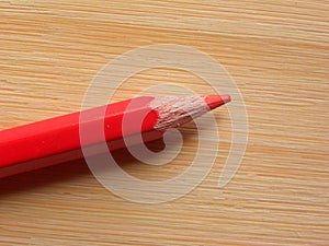 Red color pencil on table