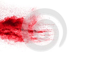Red color powder explosion on white background.