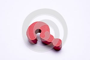 Red color question mark miniature object