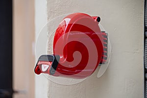 Red color shop queue eliminator fixed to the wall