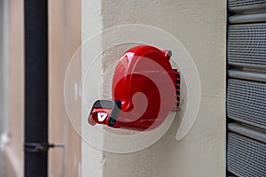 Red color shop queue eliminator fixed to the wall