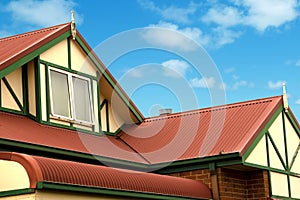 Red Colorbond Roof Underneath the Billowing Blue Sky