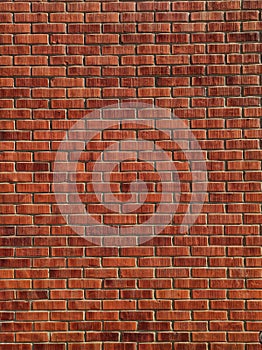 Red colored brick wall texture on sunlight