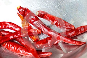 red colored hot chili on bowl