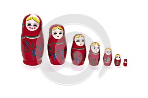 Red colored nesting dolls on a white background. Matryoshka.