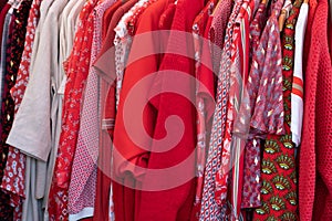 Red colored shirts top dress clothes in a hanger