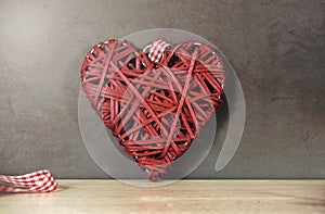 Red colored weaved heart shape photo