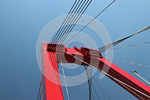 Red colored Willemsbrug over river Nieuwe Maas in Rotterdam, the Netherlands.