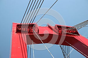 Red colored Willemsbrug over river Nieuwe Maas in Rotterdam, the Netherlands.