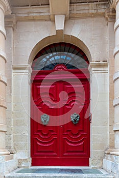 Red colored wooden door, Mdina, Malta