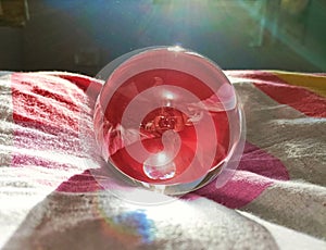 Red colour reflecting through a lensball