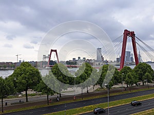 The red coloured Willemsbrug in the city center of Rotterdam