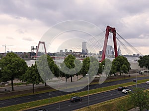 The red coloured Willemsbrug in the city center of Rotterdam