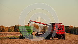 Red Combine Harvester and Green Grain Wagon