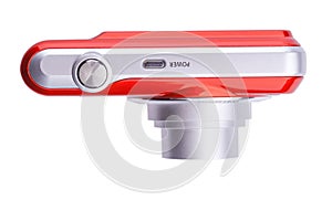 Red compact zoom digital camera over white