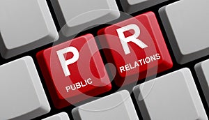 Red Computer keyboard showing PR - Public Relations photo