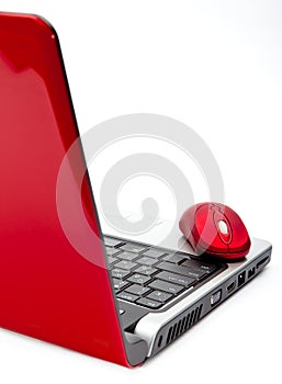 Red computer mouse and red notebook