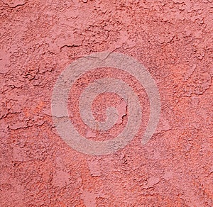 Red concrete wall with rough pattern
