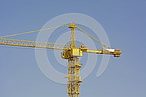 Construction cranes work at a construction site